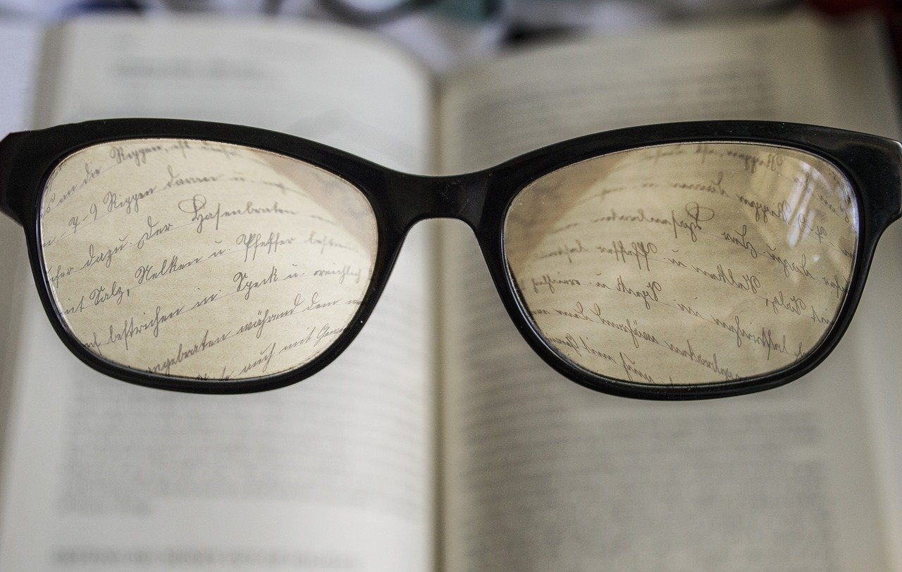 Glasses over a book - Module C Featured Image
