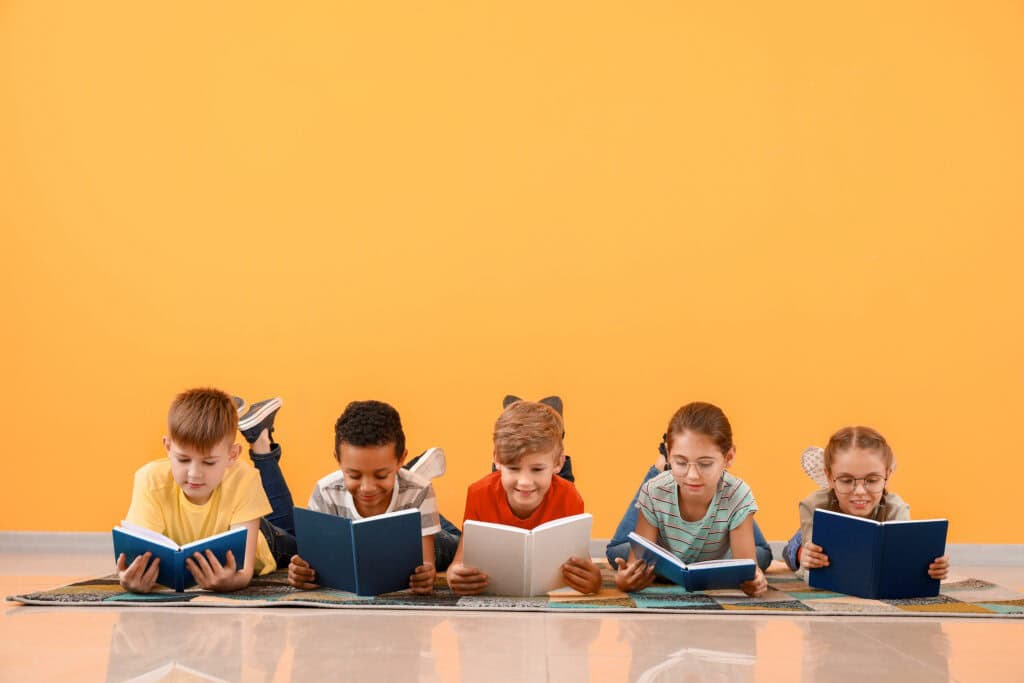 Children reading books on coloured background - Year 5 NAPLAN featured image