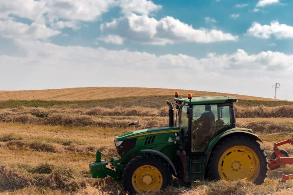 Green tractor in a field