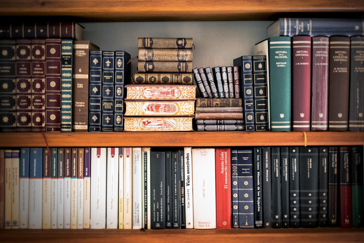 Different types of books on a shelf - QLD ATAR Subjects Featured Image
