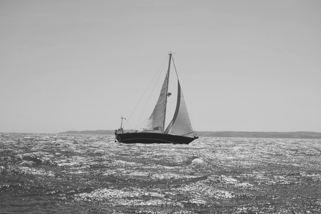 Boat in the ocean black and white