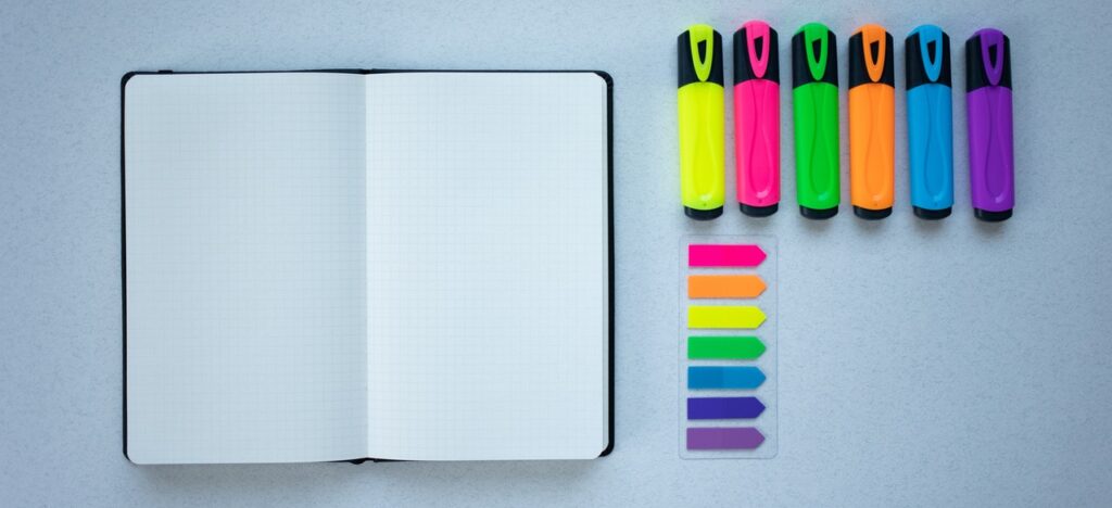 Highlighters, bookmarks and notebook