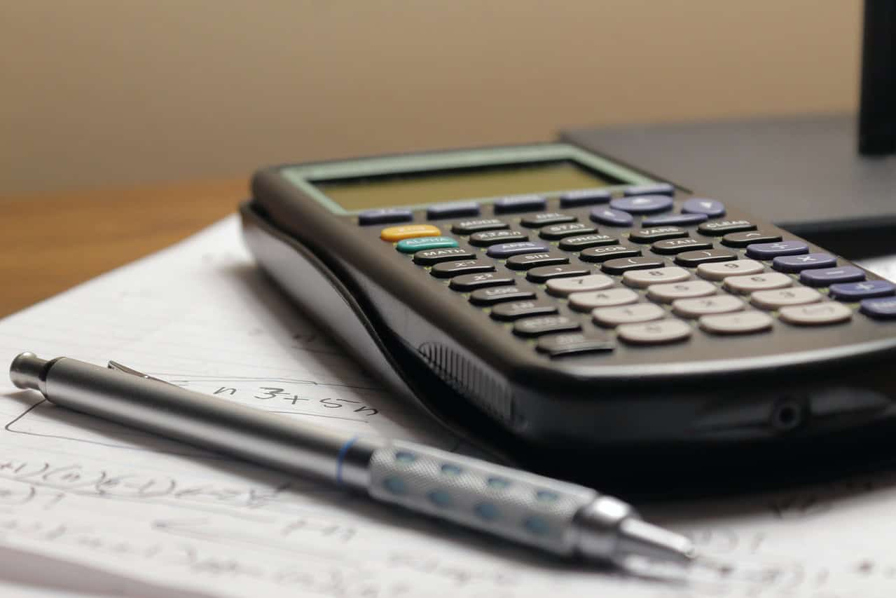 Scientific calculator next to a pen - QCE Complex Unfamiliar Questions