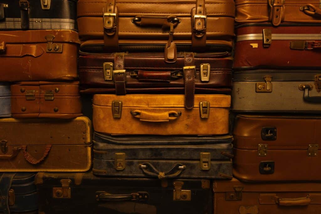 Suitcases stacked - The 7 Stages of Grieving Quotes