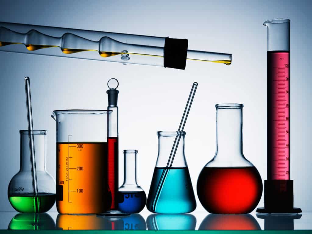 Different laboratory glassware with color liquid and with reflection - VCE Chemistry study design