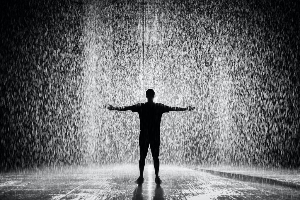 Person standing in the rain - Pathetic Fallacy
