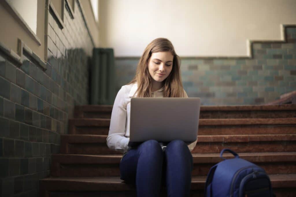 Girl typing on her laptop - VTAC Application